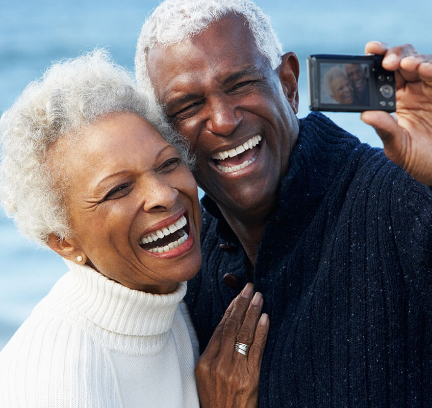 Older man and woman taking a selfie